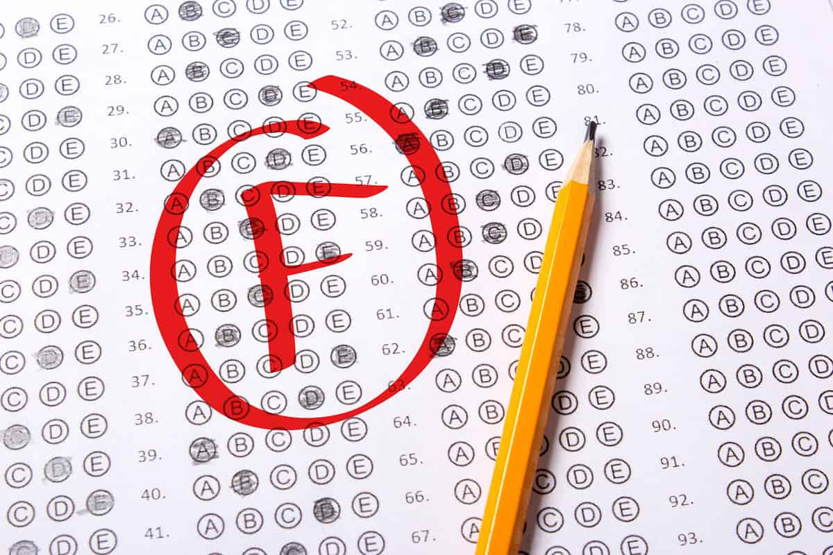 Bad grade F is written with red pen on the tests