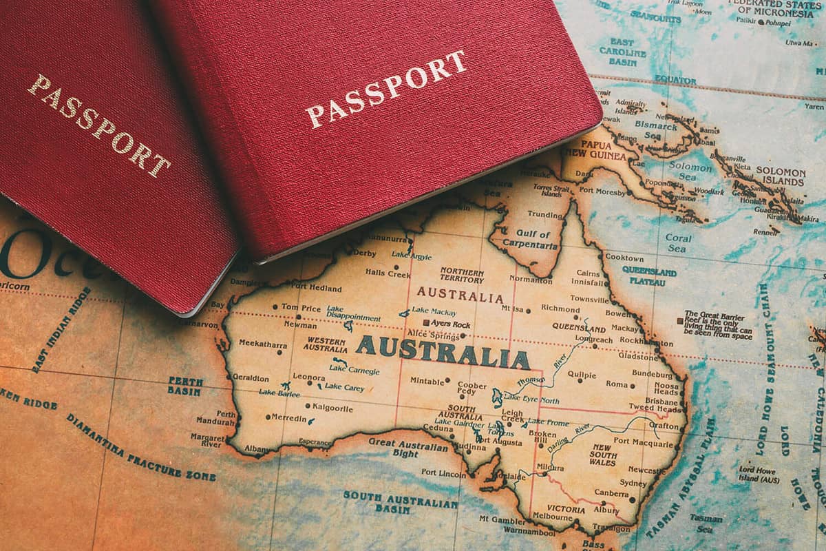 Two passports on map. Travel to Australia