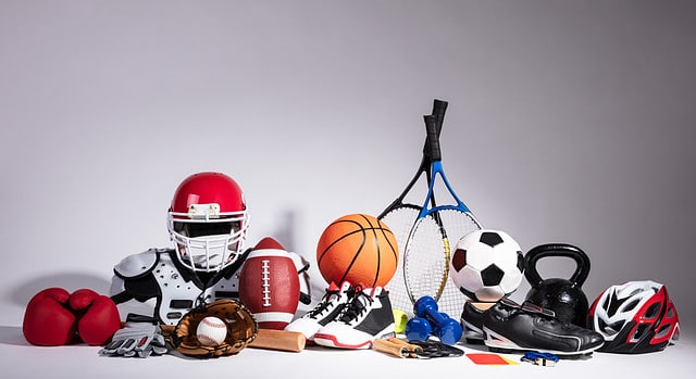 Variety Of Sport Balls And Equipment In Front Of Gray Surface