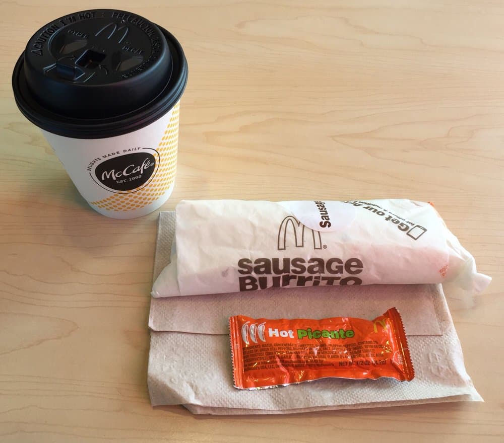 McDonald's sausage burrito with  McCafé coffee