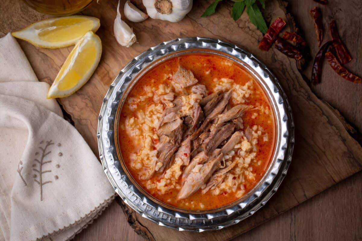 Turkish Soup Beyran with Lamb Meat, Rice, Chopped Garlic and Vinegar Sauce. Traditional Organic Food. Traditional soup of Gaziantep, Turkey. (Turkish name; Beyran corbasi)