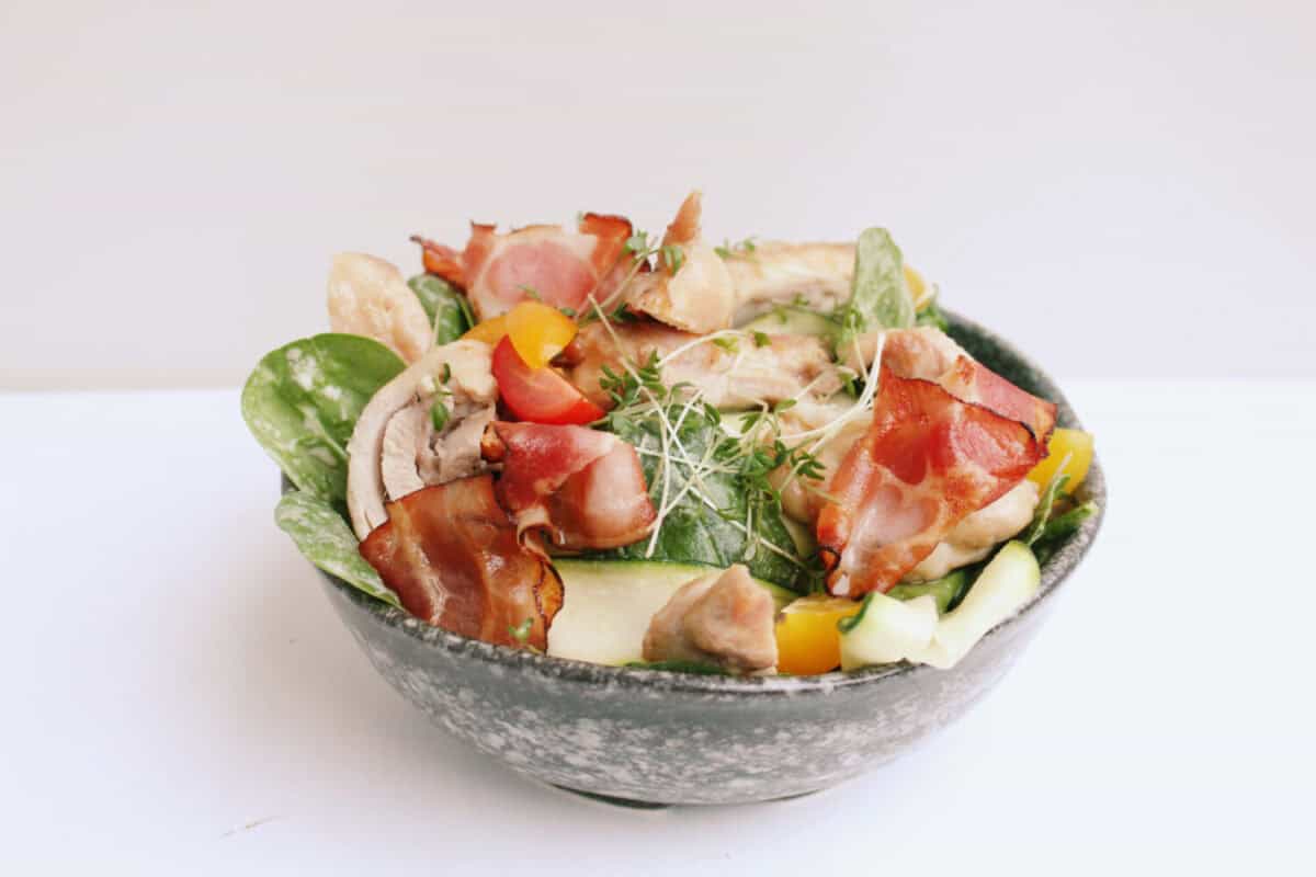 BLT salad in a bowl with chicken.