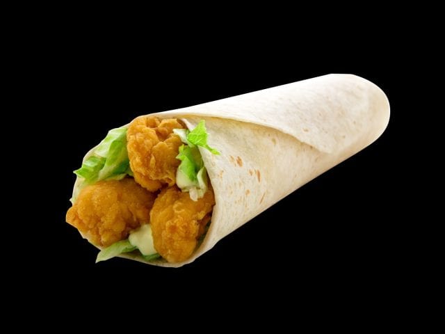 Crispy fried chicken with mayonnaise and lettuce in a tortilla bread