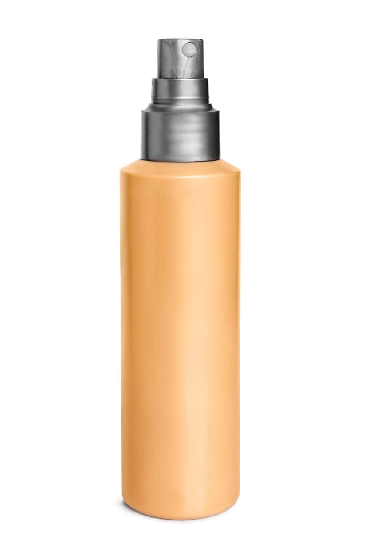 Blank yellow mist spray bottle isolated on white background. Best treatment options for diaper rash.