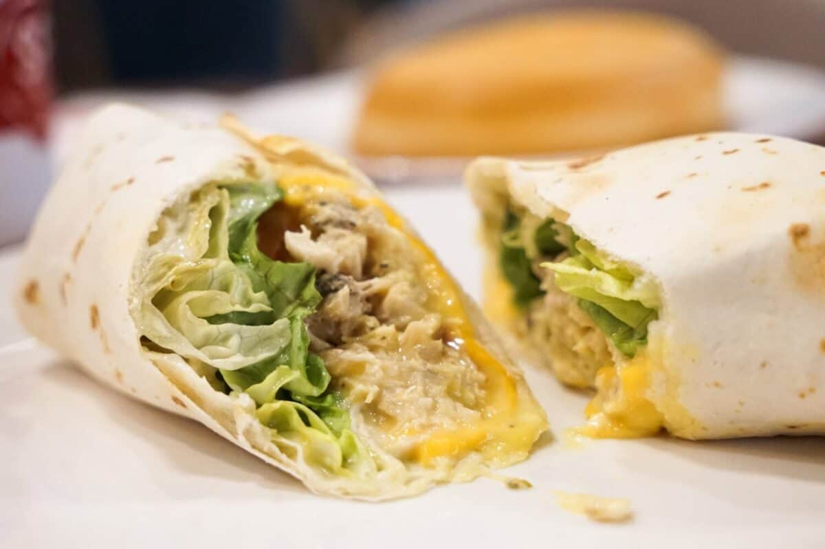 Close up of chicken wrap with honey mustard in a café