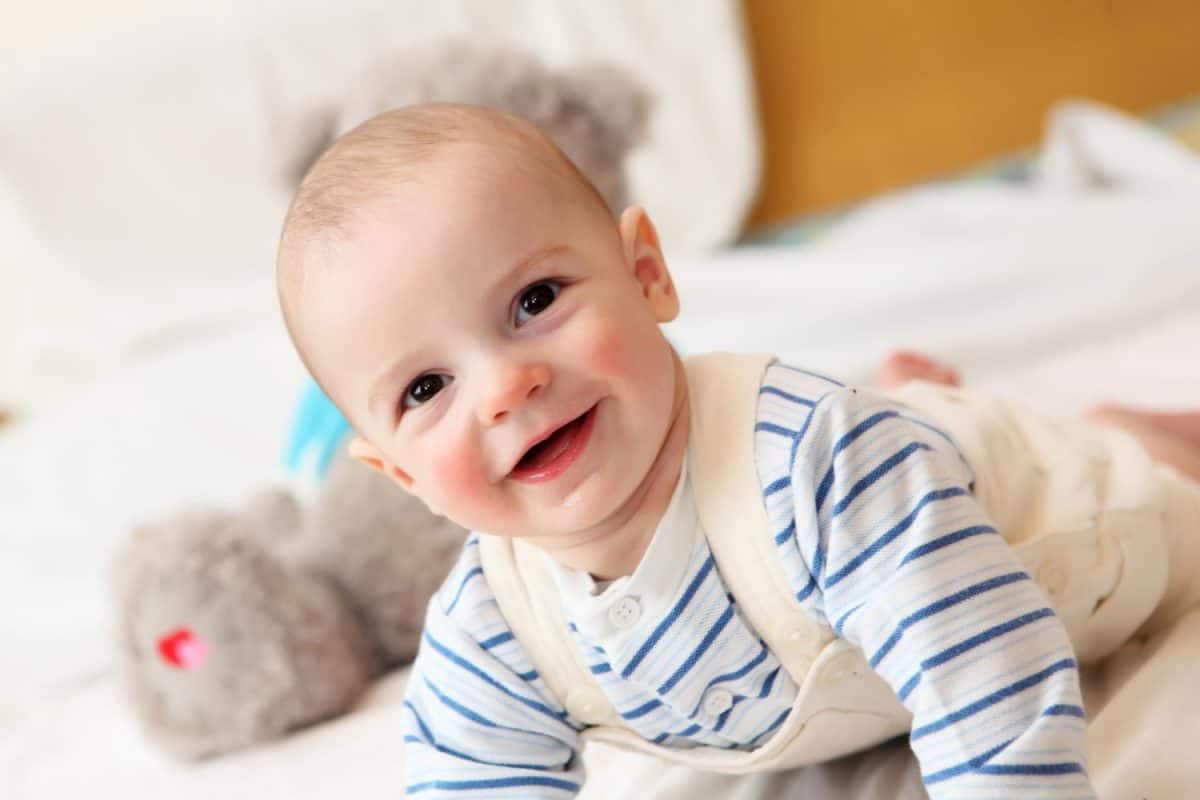 portrait of happy little baby boy smiling