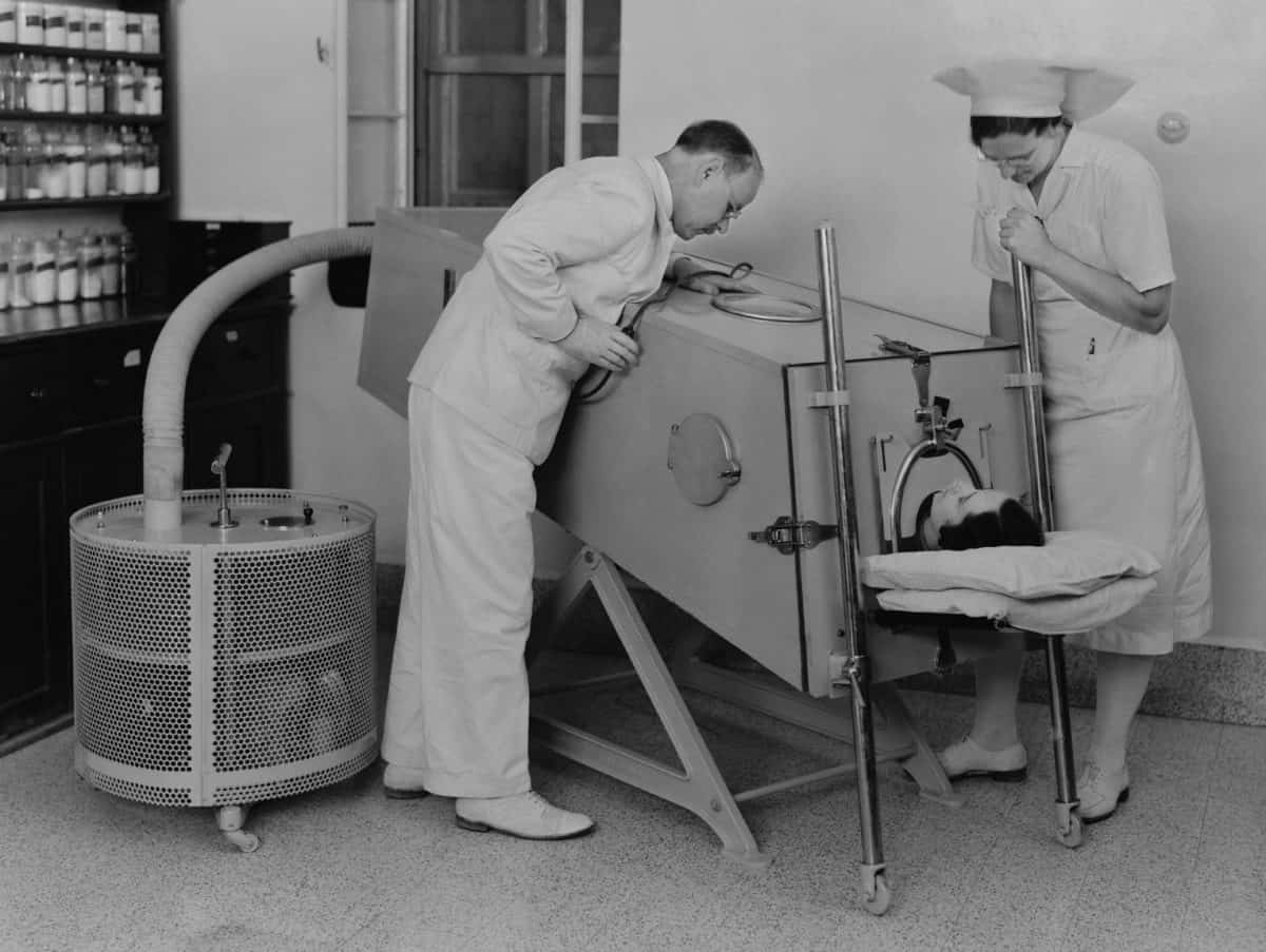 Polio patient in an iron lung at the Scots Mission Hospital in Tiberias, Palestine in March 1940. When polio weakened muscles used in breathing, an iron lung assisted respiration.