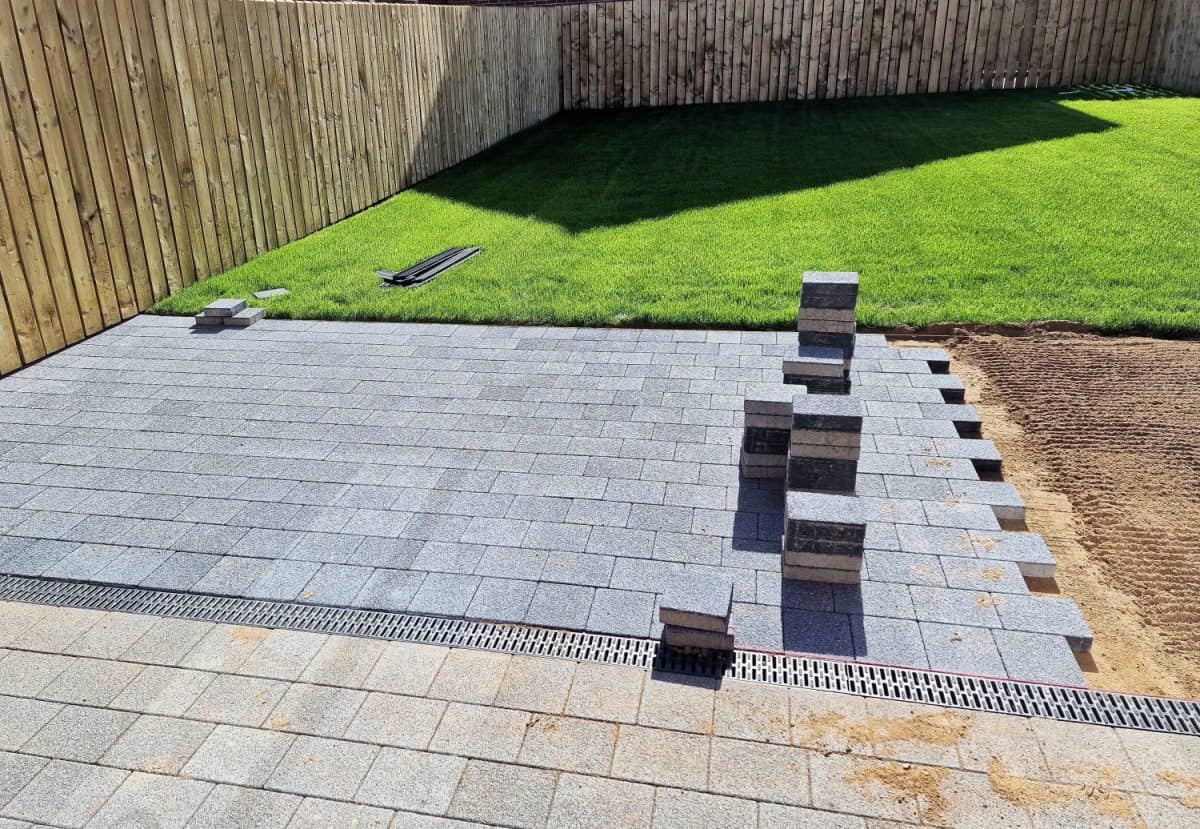 A stone paver patio in the process of being installed in a garden. How To Trim Guinea Pigs Nails