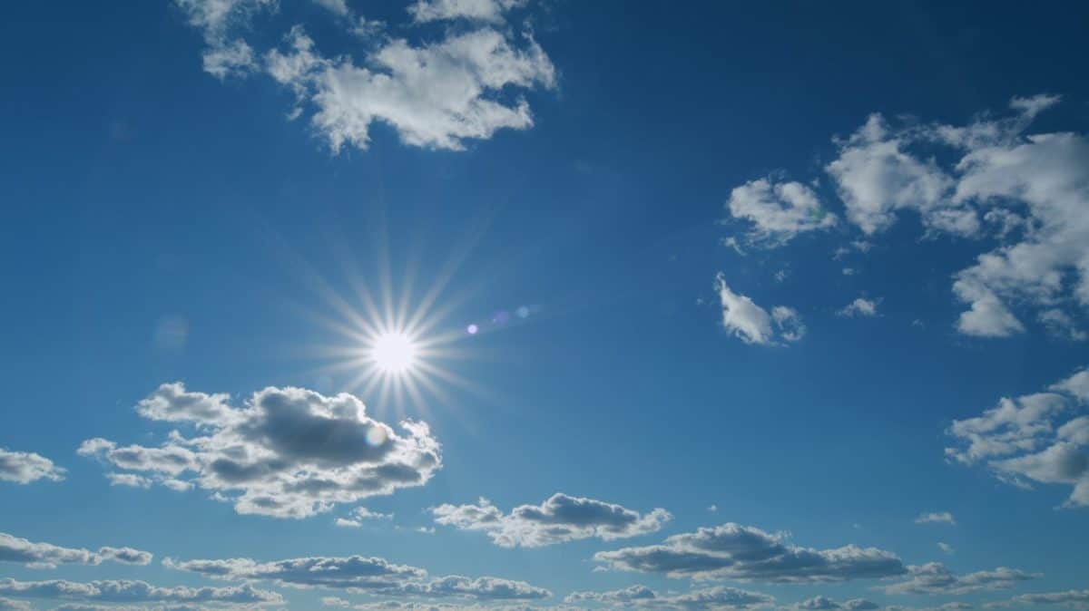 Clouds moves in the blue sky. Beautiful sky cloudy behind shining sun rays and eventually breaking through cloud mass. Timelapse. To foolproof way to easily grow basil.