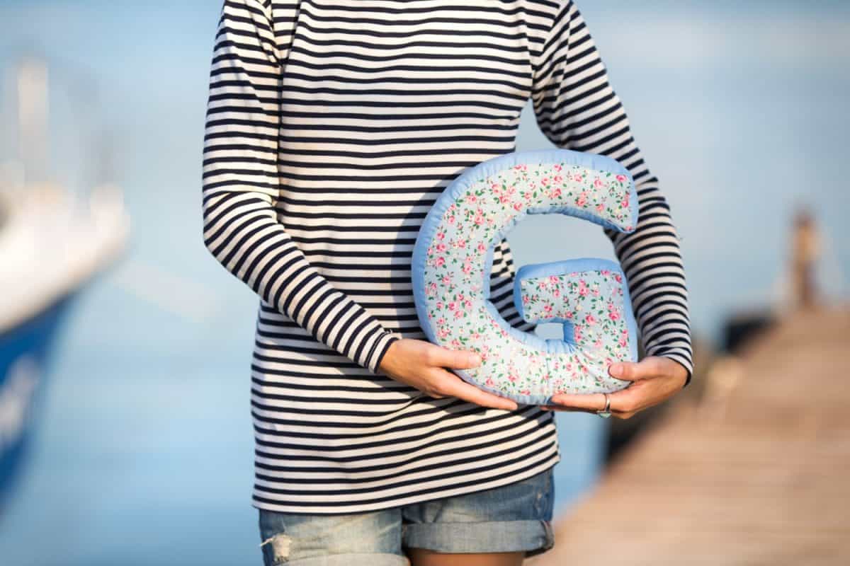 Close up photo of a big handmade pillow letter G