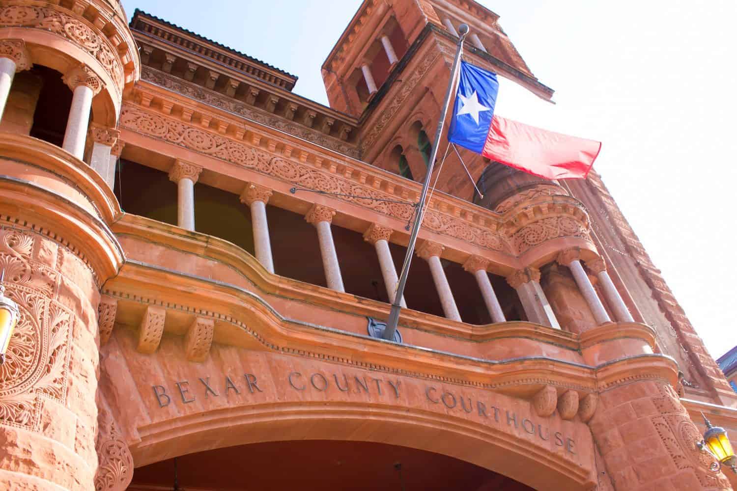 Bexar County Courthouse with Waving Texas Flag