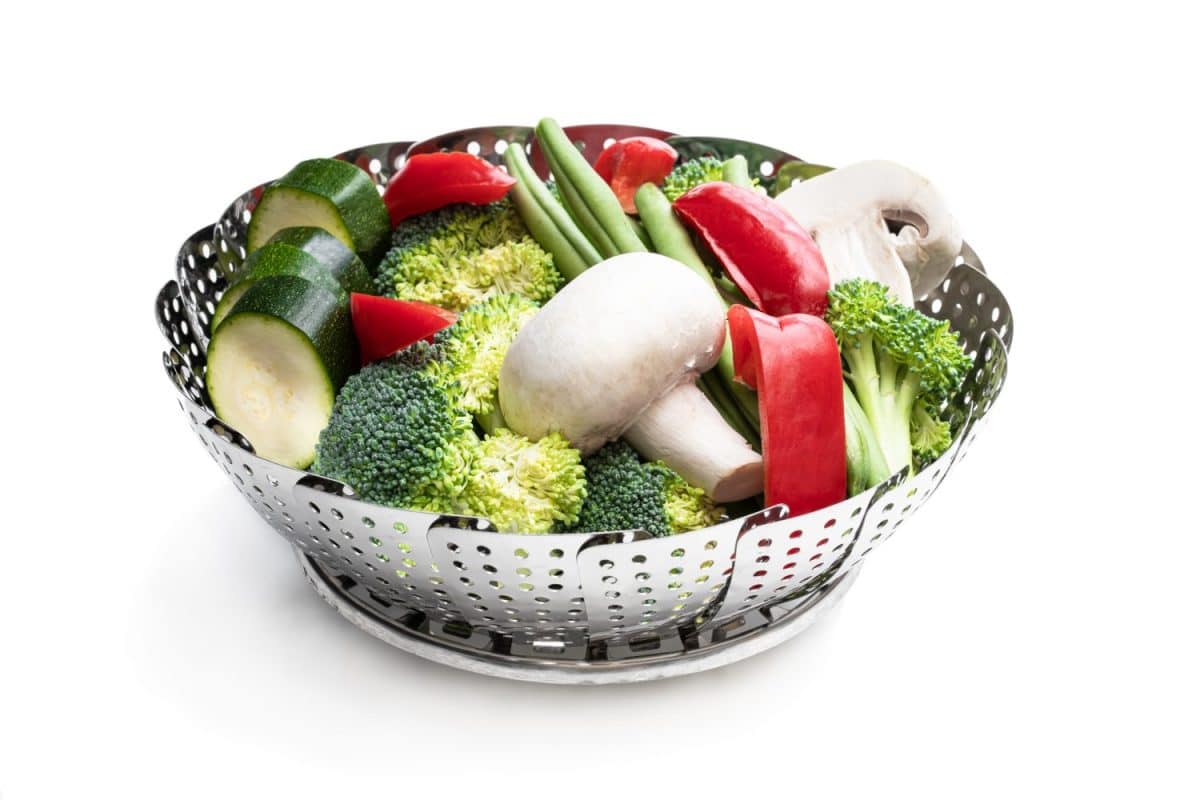 Fresh raw vegetables in steam basket. Ready for cooking.