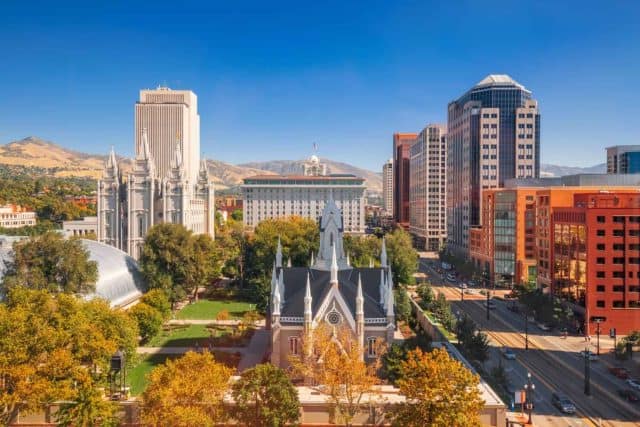 Salt Lake City, Utah, USA downtown cityscape over Temple Square with autumn foliage.