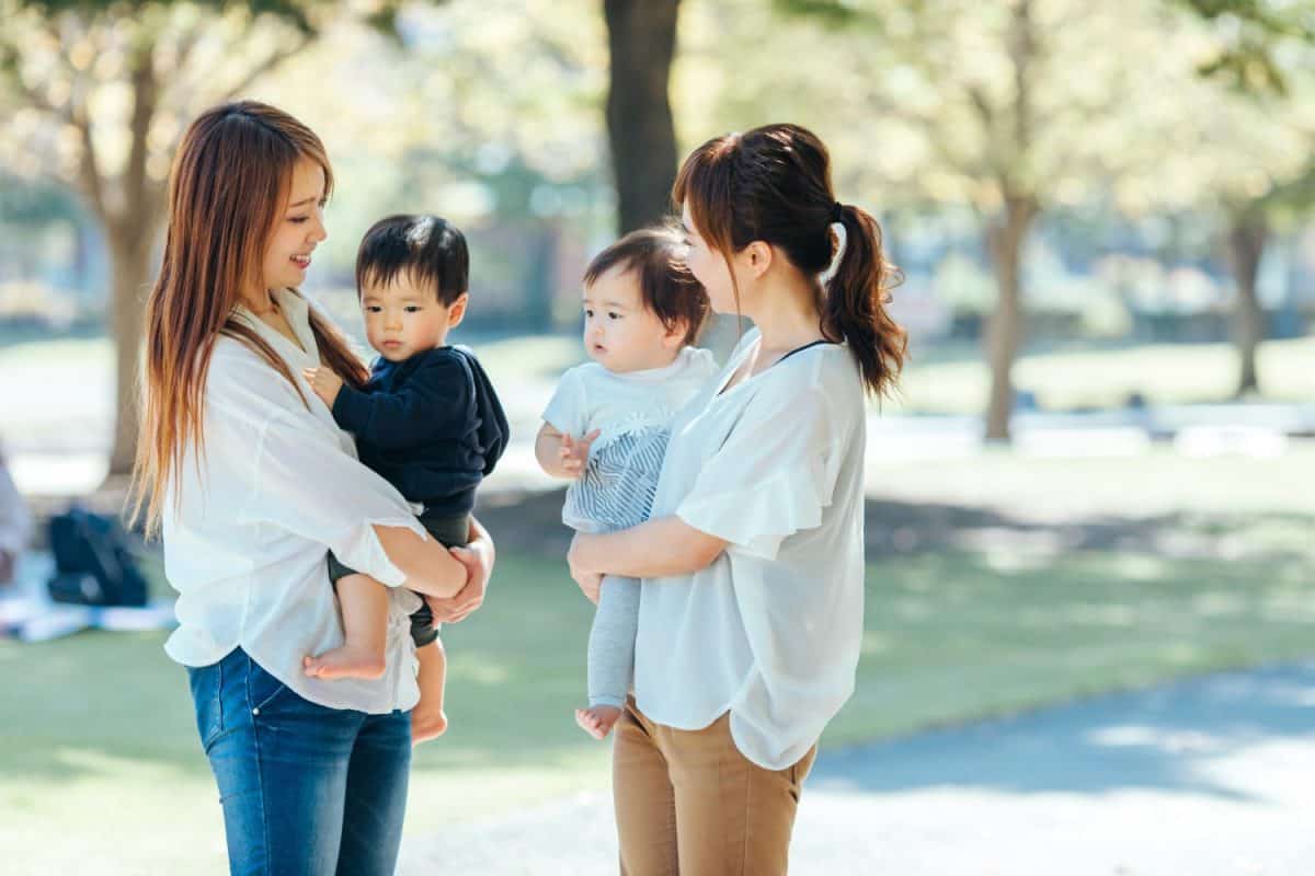 Asian woman chatting with her mom friend