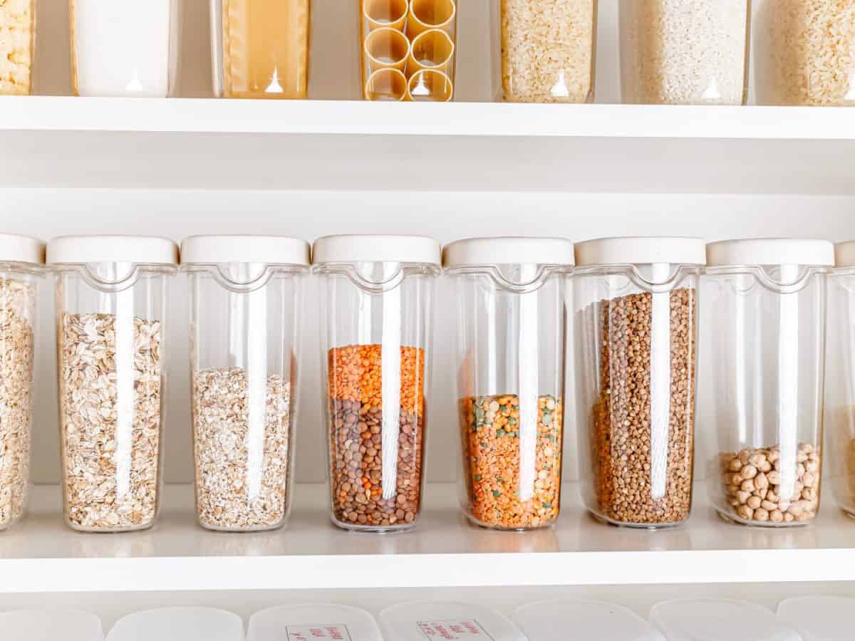 Stocked kitchen pantry with food. The organization and storage in a kitchen in plastic containers. White modern kitchen. full kitchen pantry food storage illustration