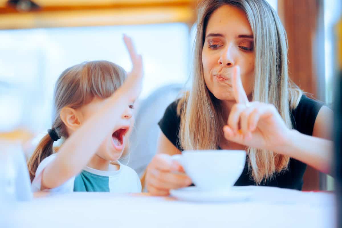 Mother Scolding Disobedient Naughty little Daughter Mom setting rules for toddler to follow and model public behavior