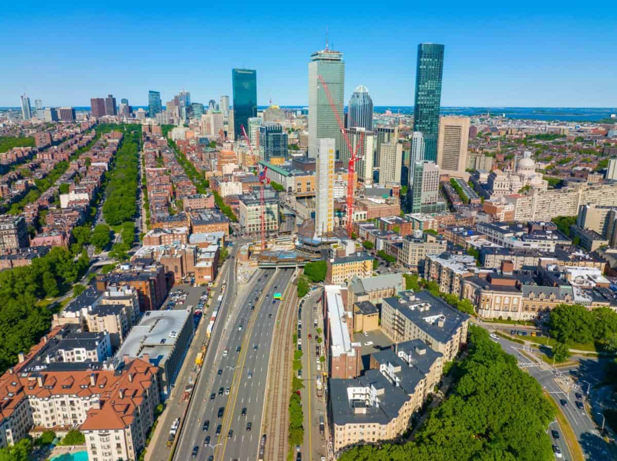 Boston Back Bay skyline and Interstate Highway 90 including John Hancock Tower, Prudential Tower, and One Dalton Street building in Boston, Massachusetts MA, USA.