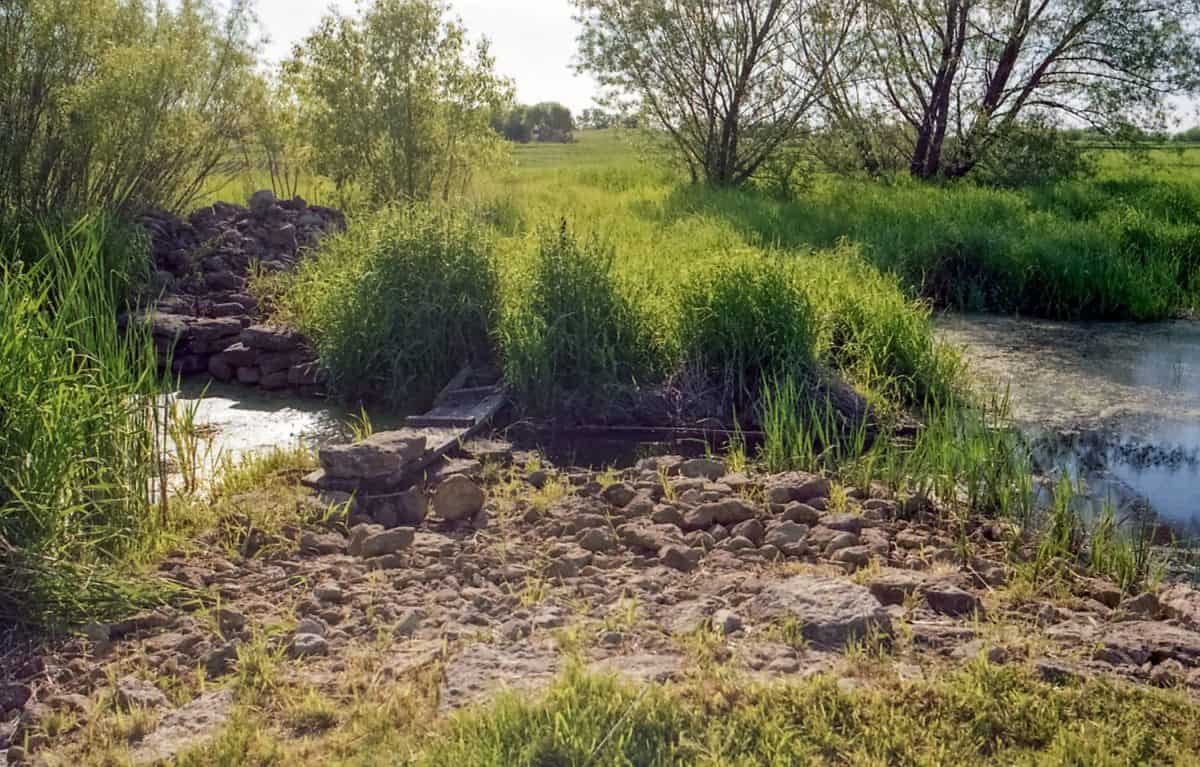 Historic section of Wisconsin's Old Military Road crossing the Rock River Branch at the Raube Road Historic site near Brandon, Wisconsin; park;