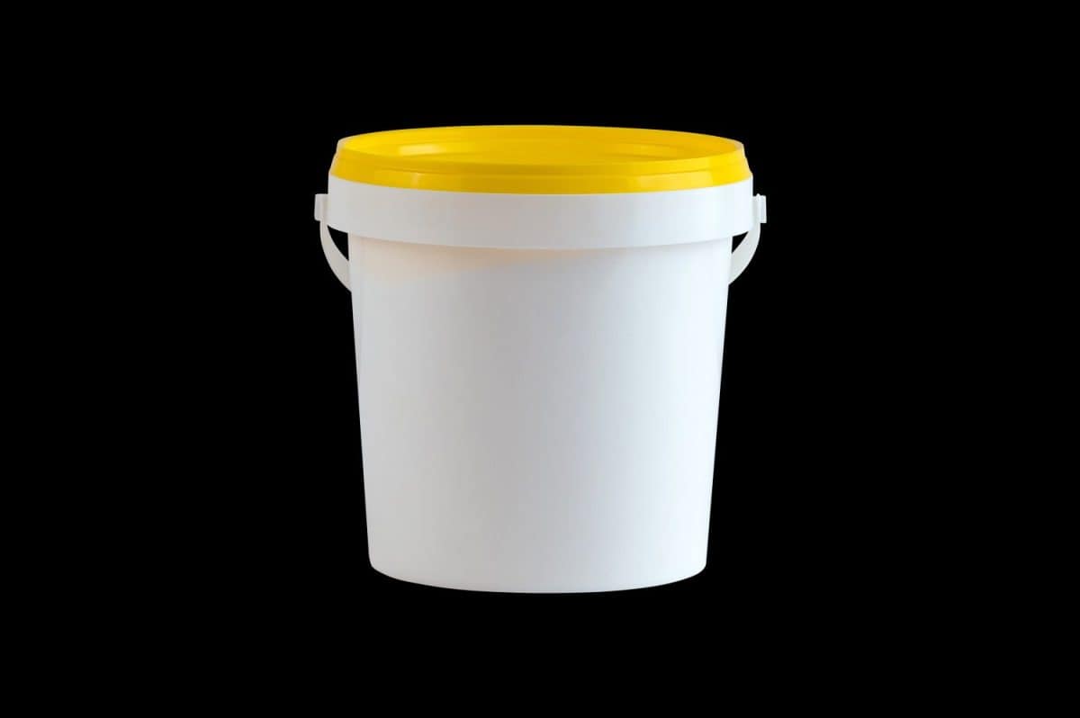 White plastic bucket with handle isolated. Essential steps to kill weeds with vinegar.