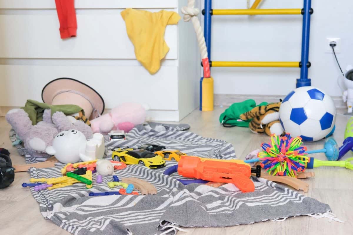 Children's room is mess, many toys are scattered. Dirty house.