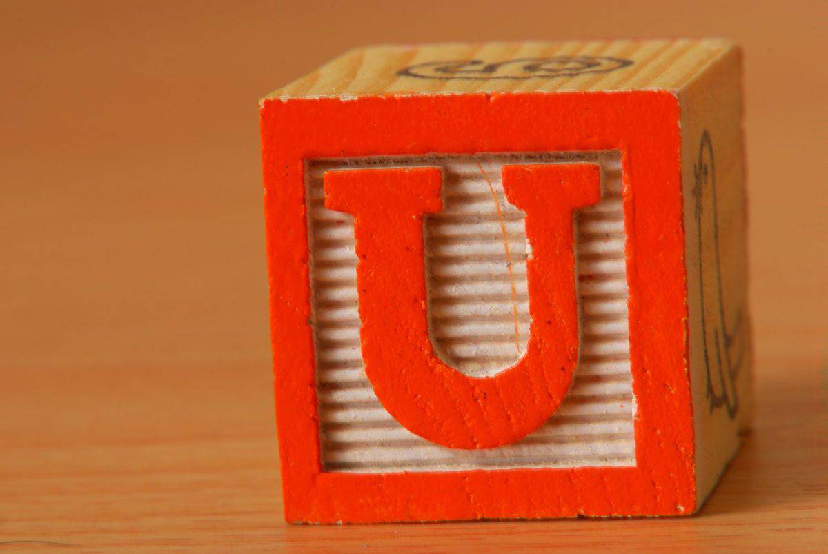 Alphabet block with an orange letter U