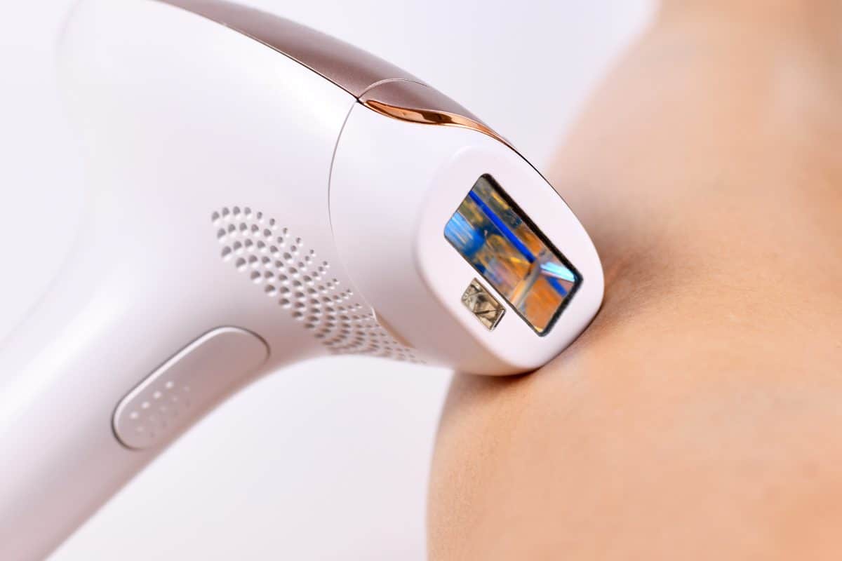 IPL 'Intense Pulsed Light' laser hair removal home device next to bare leg