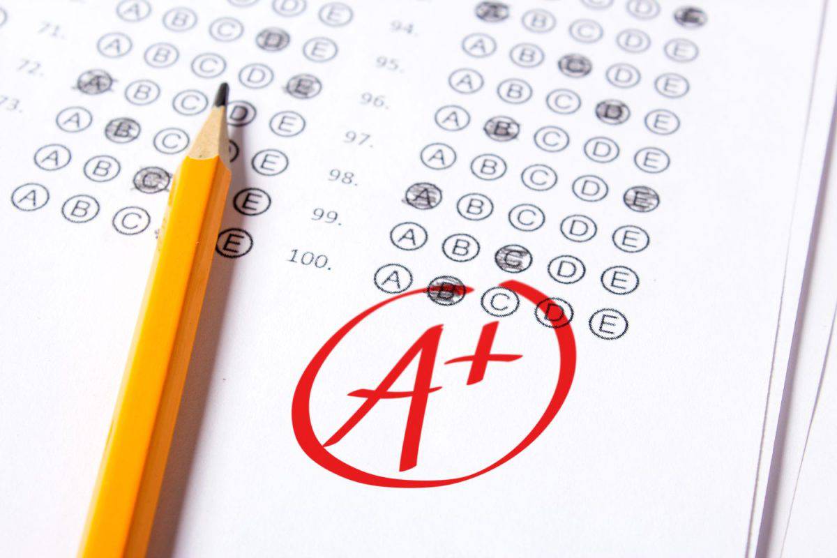 Good grade of A plus (A+) is written with red pen on the tests.