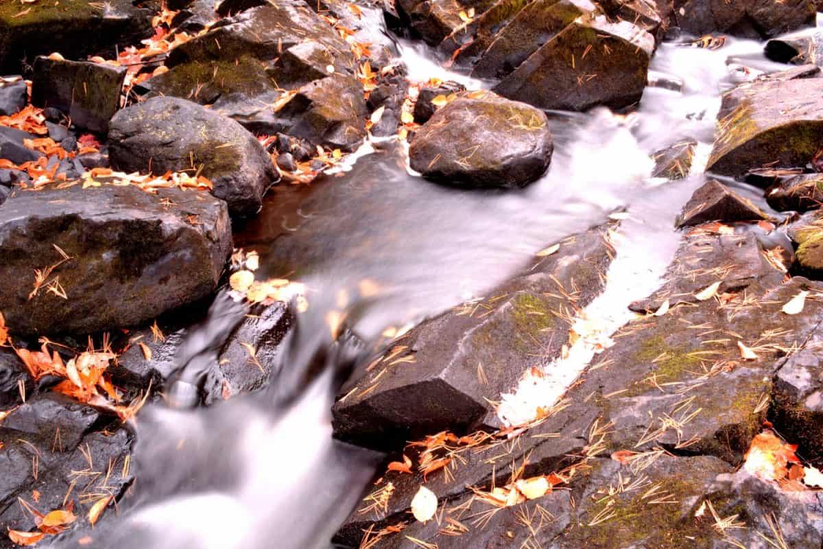 Kakabika Falls in the upper peninsula of Michigan on a cold autumn day with small waterfalls along the narrow river in Marenisco Township.