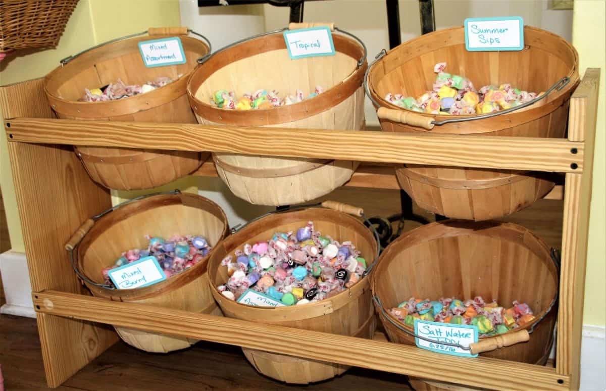 Homemade Salt Water taffy in baskets in a variety of colors. Candy on display in an old fashioned candy store