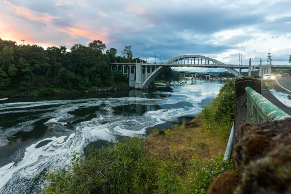 The Oregon City Bridge, also known as the Arch Bridge, is a steel through arch bridge spanning the Willamette River between Oregon City and West Linn, Oregon, USA