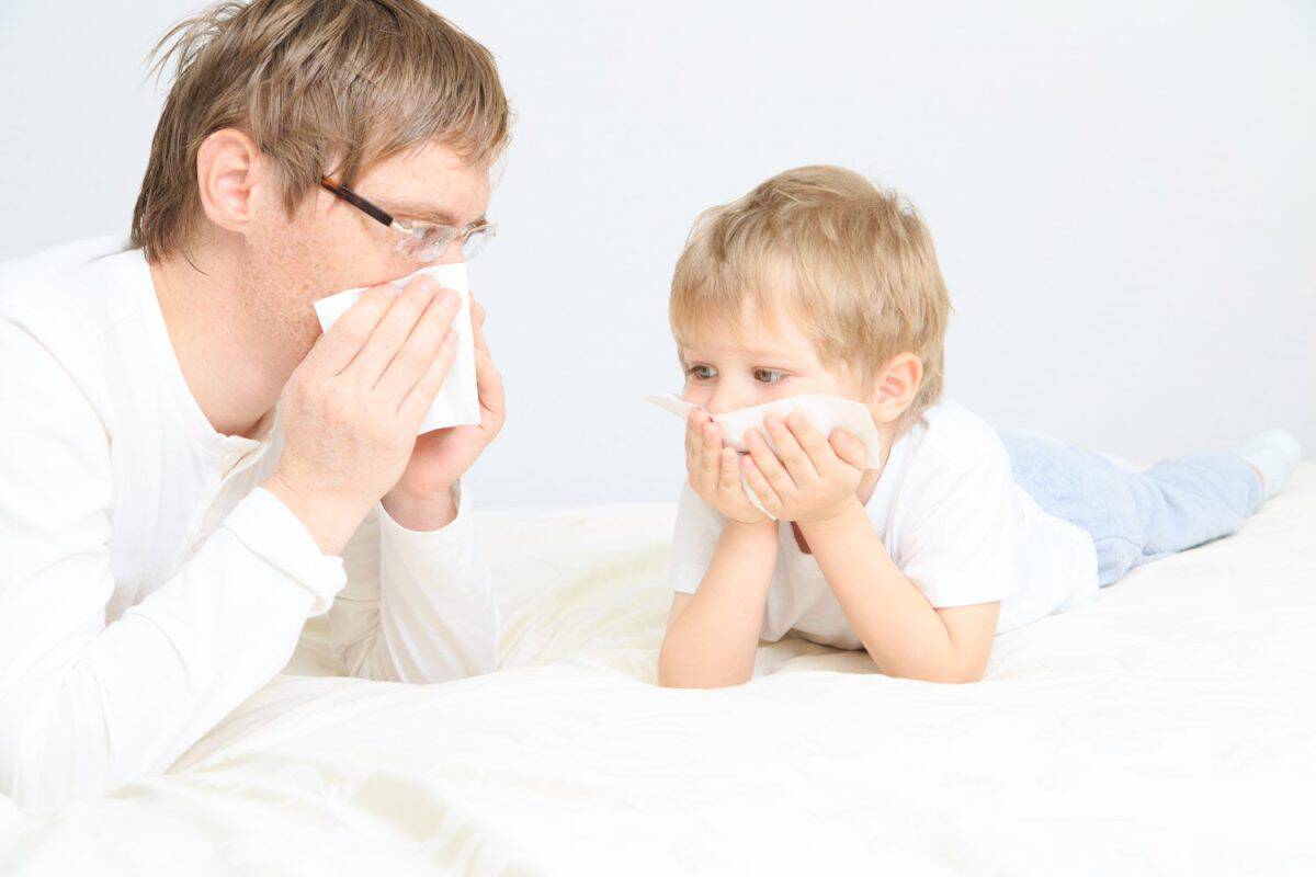 father and son wiping nose, illness. These Are the Traits You Got From Your Father