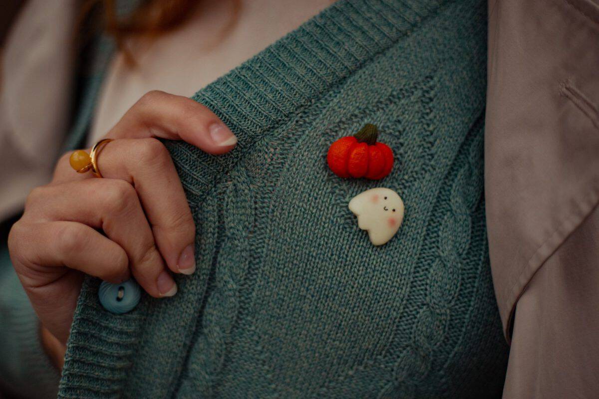 halloween pins on the women's cardigan