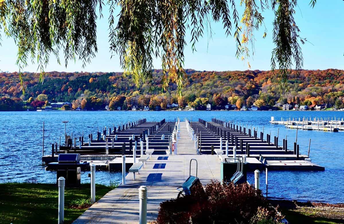 Pier with boat dockage at the marina of Keuka Lake, Penn Yan, New York. Autumn landscape scene. Finger Lakes region. Morgan Marine