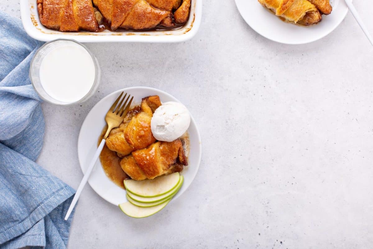 Apple dumplings in flaky pastry with caramel sauce and ice cream. Apple Dessert Recipes to Make the Most of This Fall's Harvest