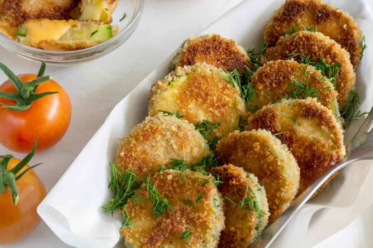 Breaded fried pieces of healthy yummy vegetables with tomatoes and sauce. Healthy lifestyle concept. 25 portable snacks to always have on hand.