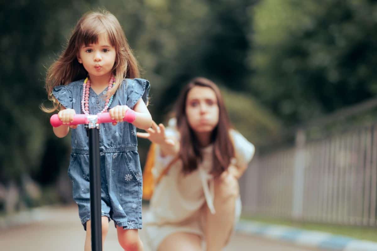 Stressed Overprotective Mom Stopping her Kid on a Scooter. Mother obsessed with control practicing helicopter parenting style