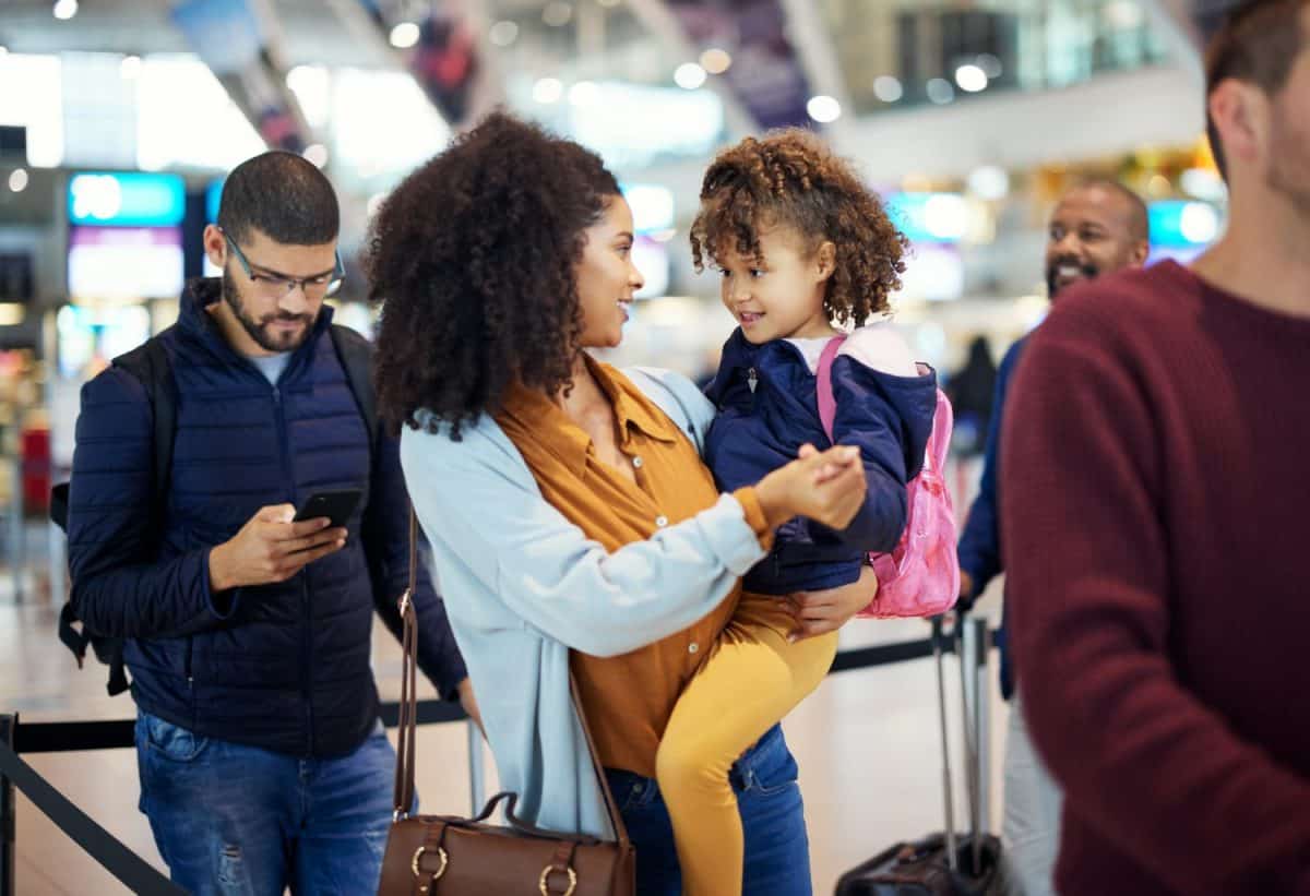 Airport line, mother and girl at international flight check for plane board or airplane ticket payment. Happy mom, child and family waiting at gate for air travel and security before transport