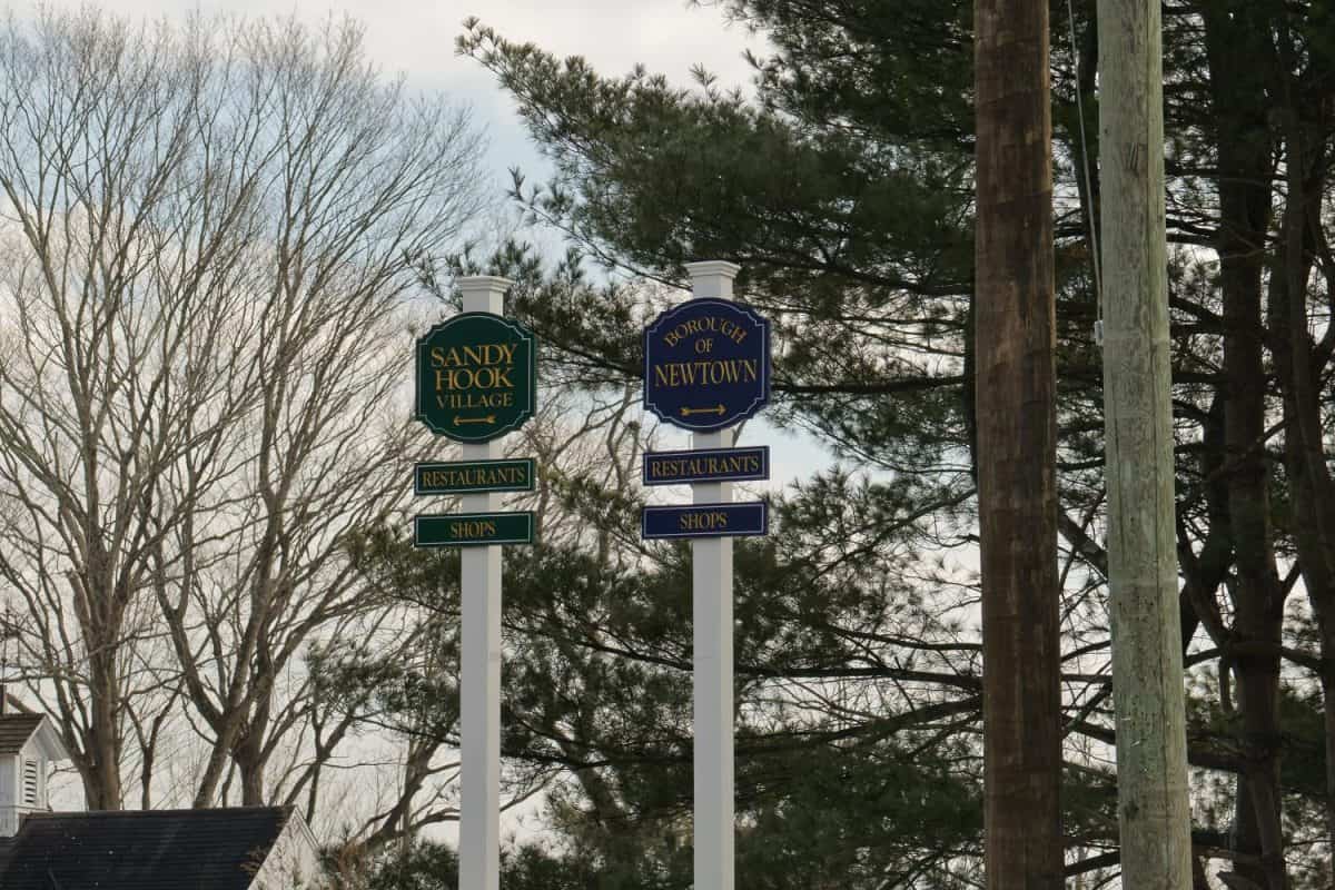 signs in Newtown, Connecticut directing to the Borough of Newtown and Sandy Hook Village, restaurants and shops