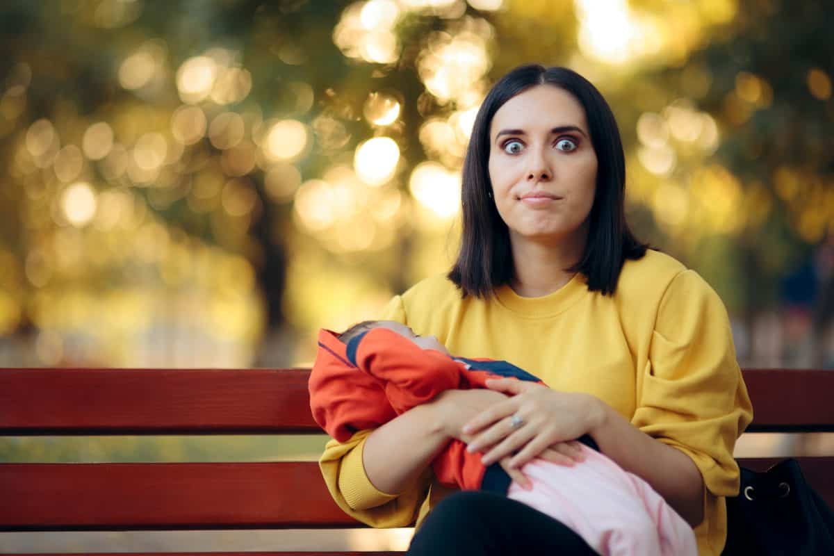 Mom Feeling Insecure Holding Newborn Baby. Stressed new mother feeling the pressure of motherhood