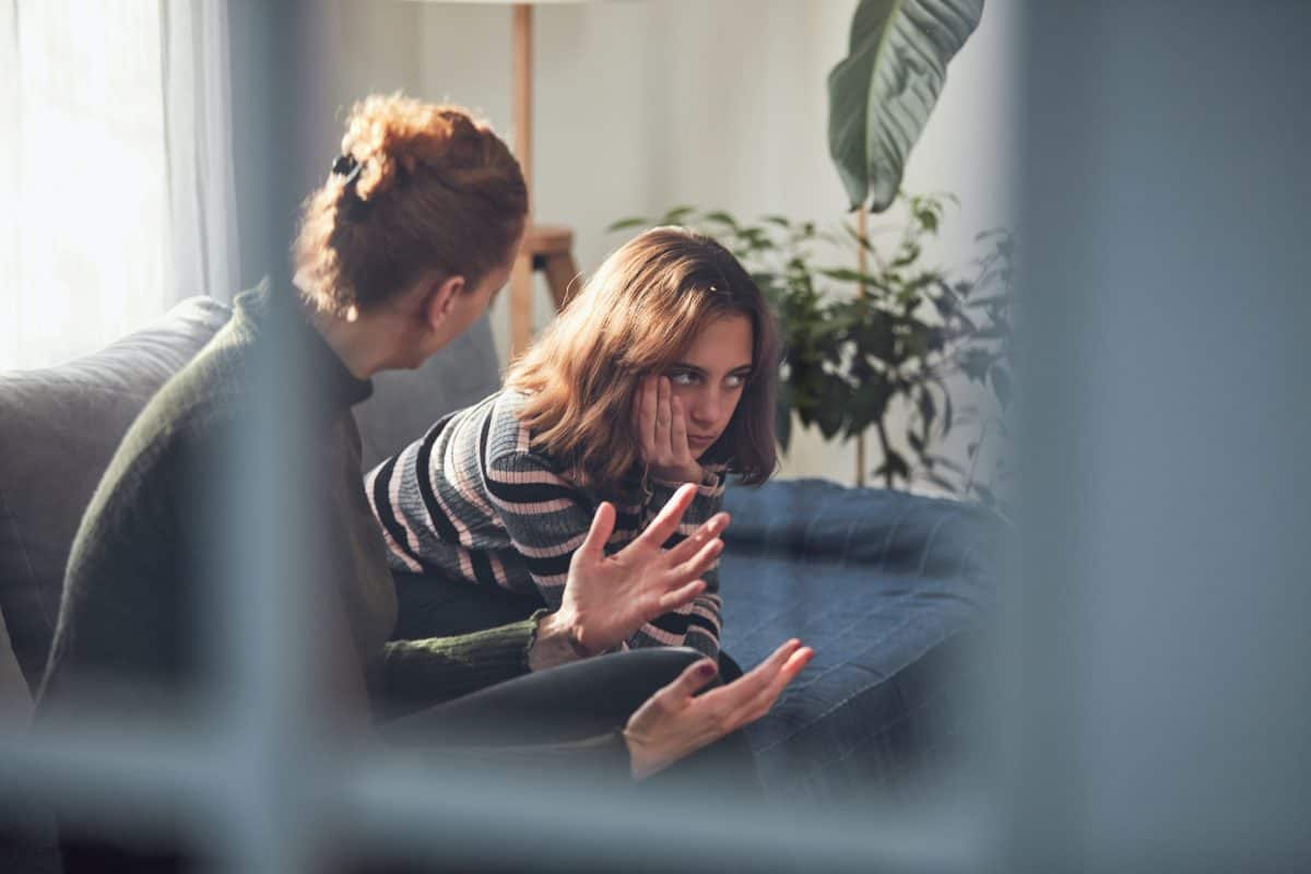 Teenage girl in difficult mood with angry mom.