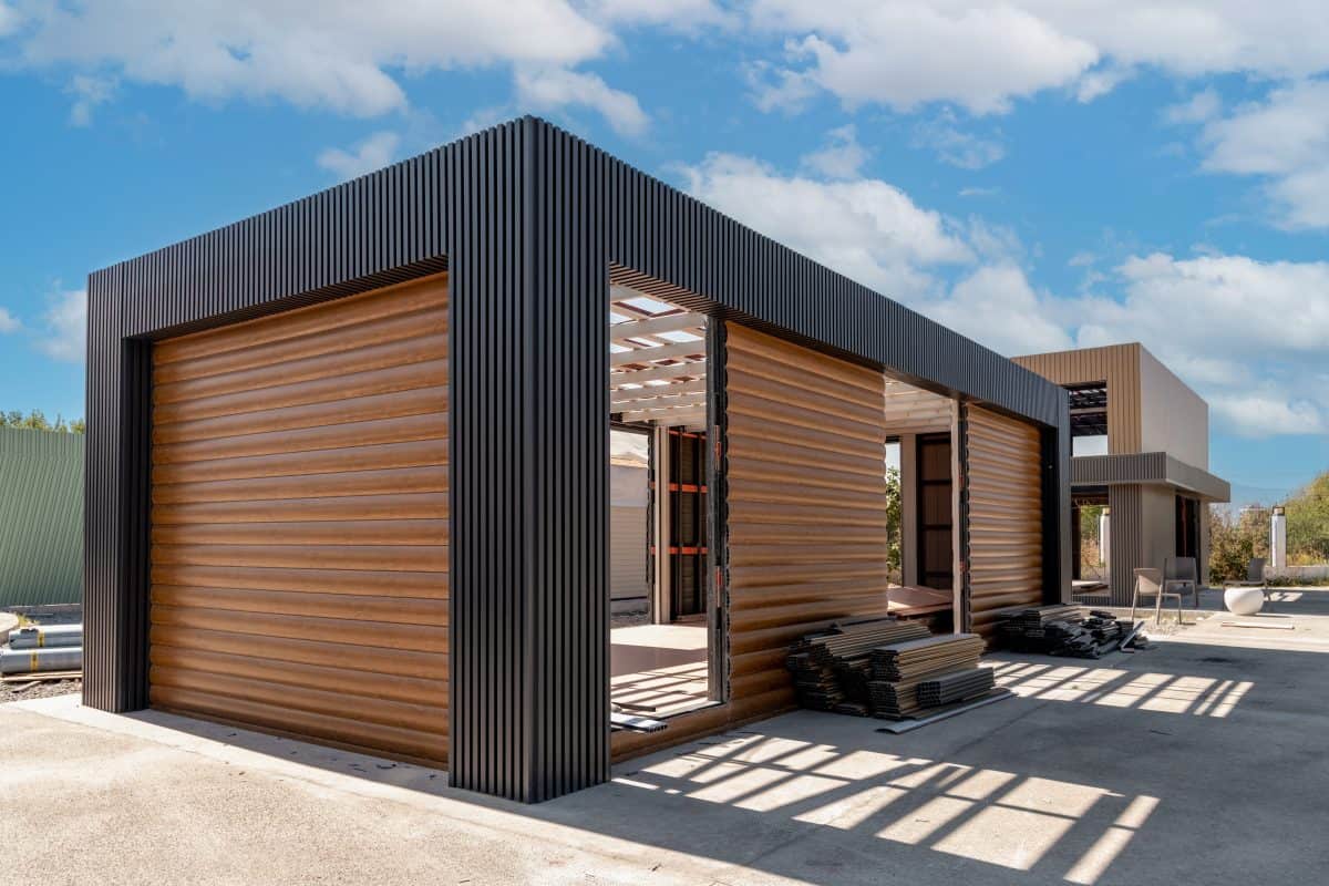 Newly built metal framed building with siding. Construction of a new tiny house. selective focus