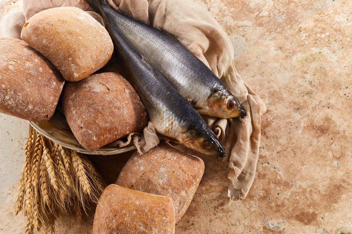 Catholic still life of five loaves of bread and two fish