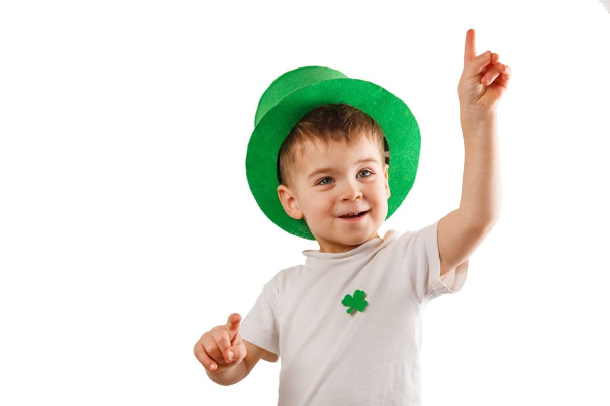 Little boy with Leprechaun hat on white background. St Patrick's Day.