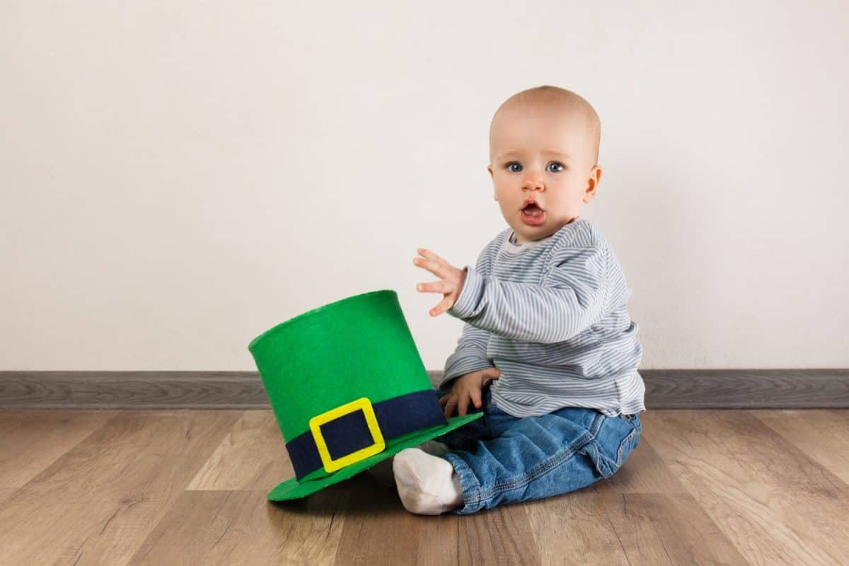 Little boy with Leprechaun hat on white background. St Patrick's Day.