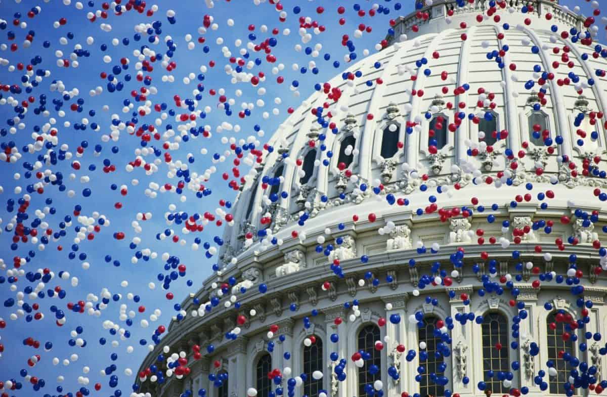 Close-up of the U.S. Capitol dome while thousands of balloons flying by during the Bicentennial of the Constitution Celebration