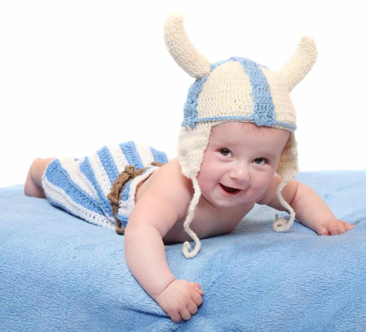 Little viking in handmade knitted costume.