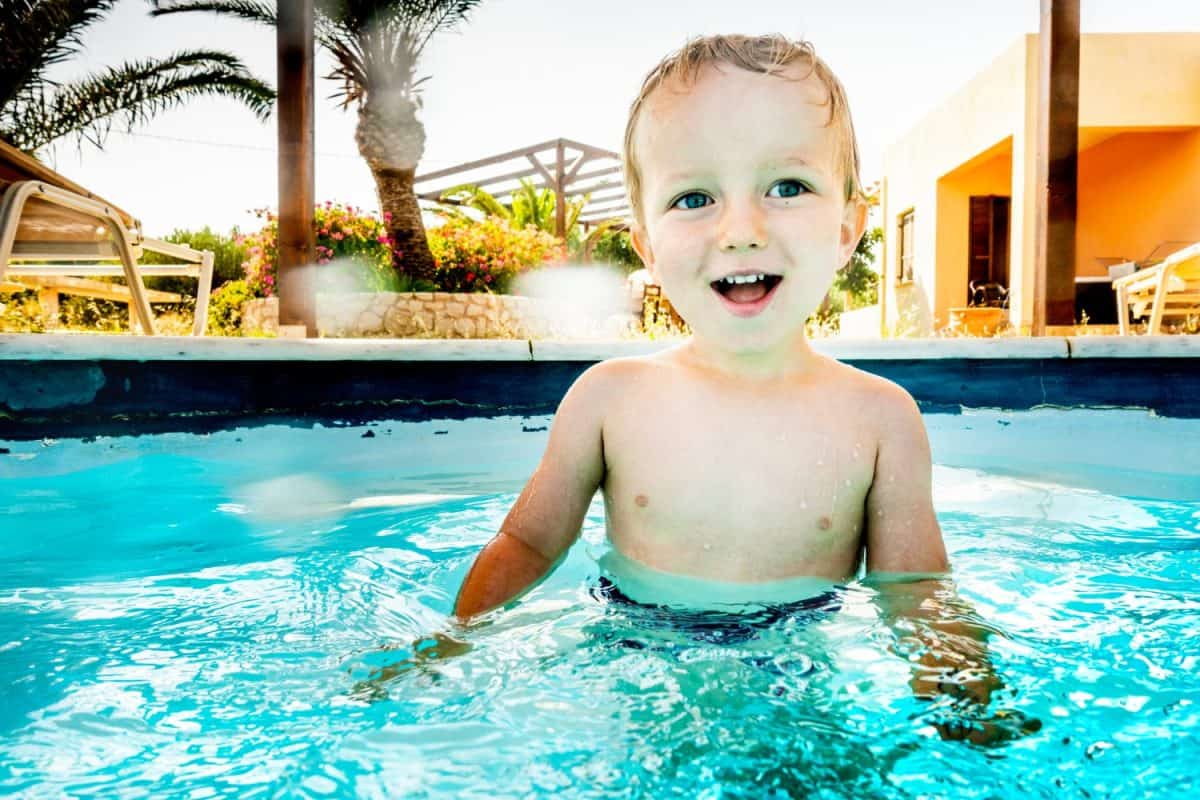 Baby boy swimming in pool, Crete, Greece