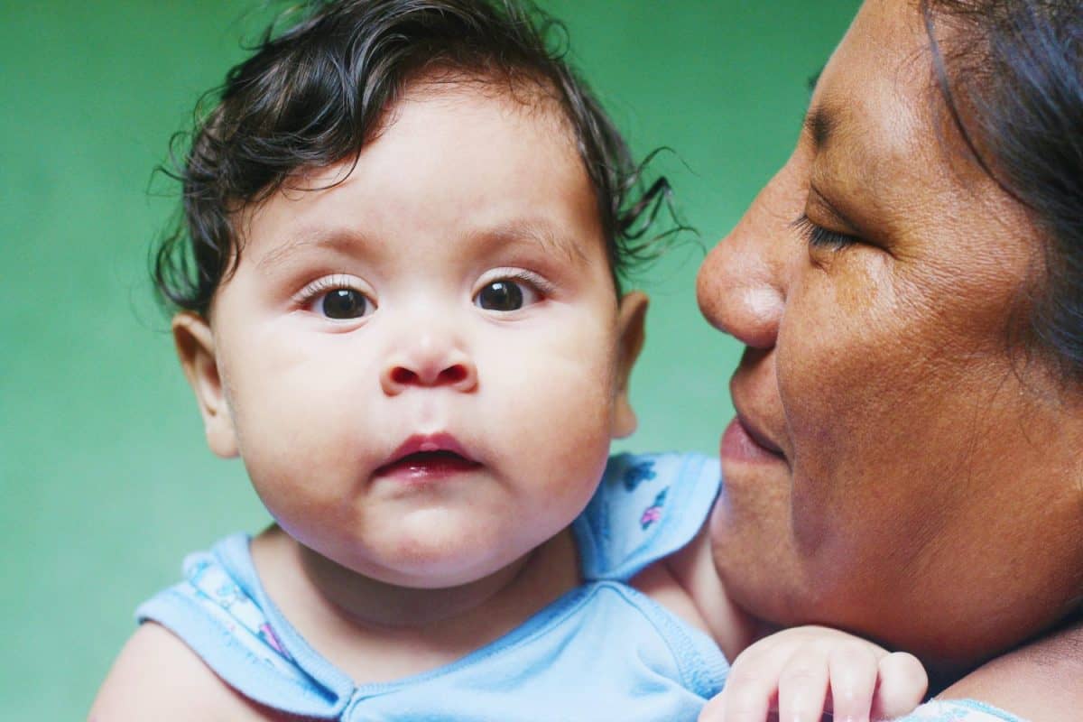 Interracial family. Native american woman with her baby boy.