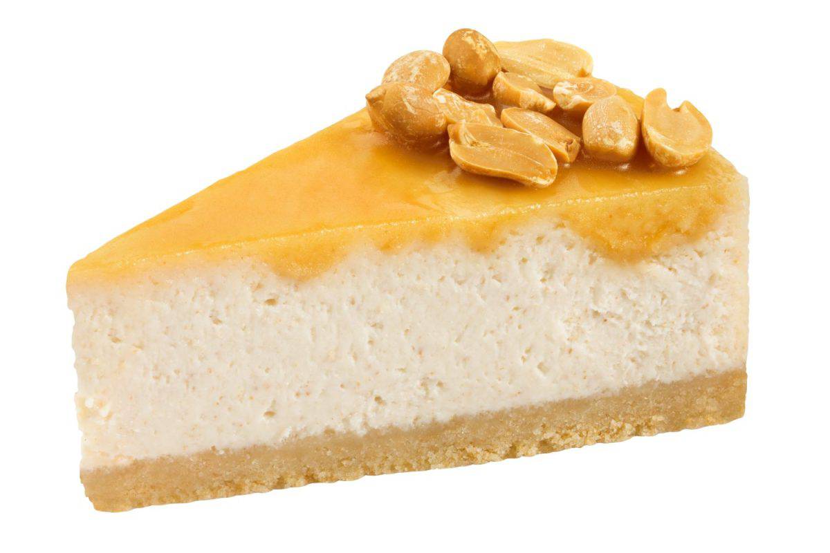 Piece of peanuts cheesecake isolated on white background, clipping path, full depth of field