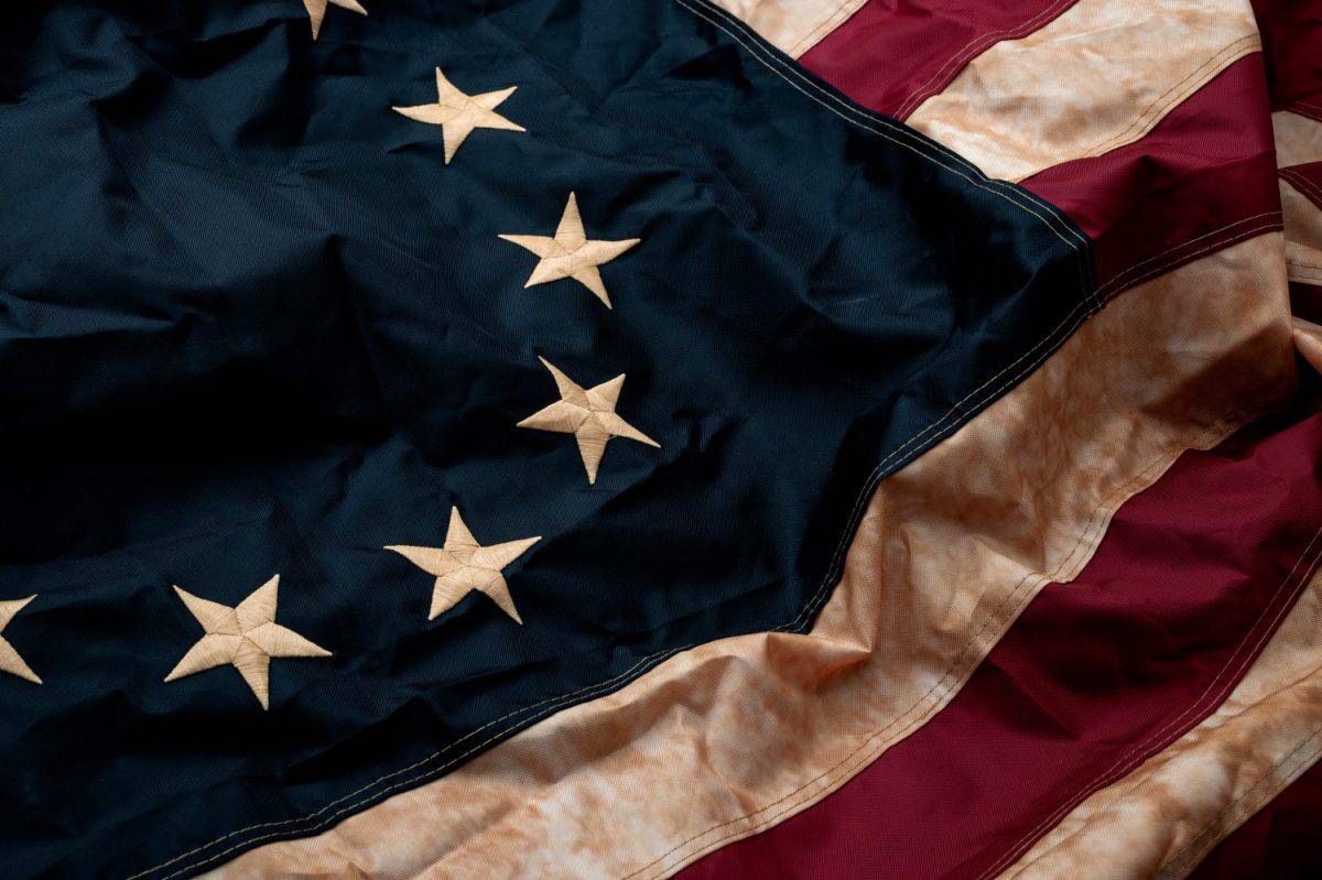 Revolutionary war, patriotism and birth of the United Sates of America concept with closeup on the original 13 star American flag known as the Betsy Ross